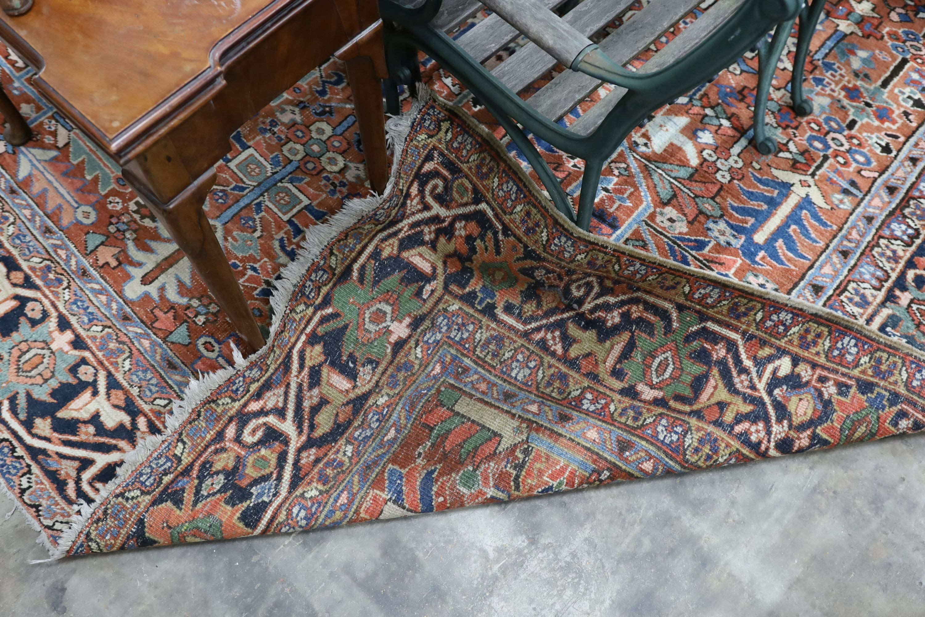 A Caucasian red ground carpet, 390 x 285cm